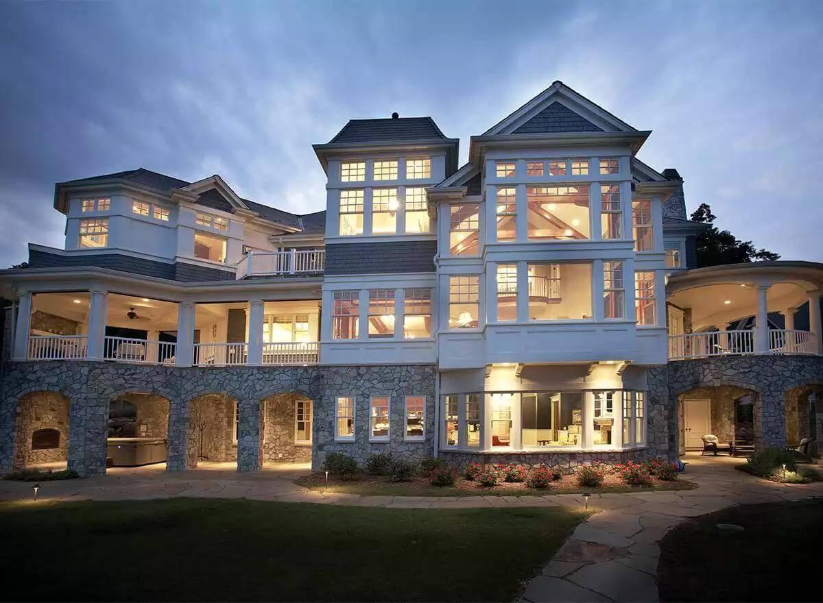 Admire the Intricate Light Play Against the Shingle and Stone Exterior