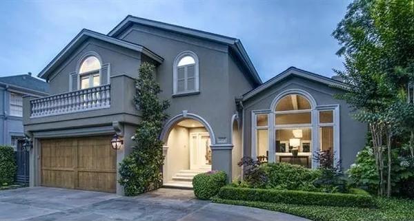 Elegant Arched Entryway and Balcony in This Classic Home