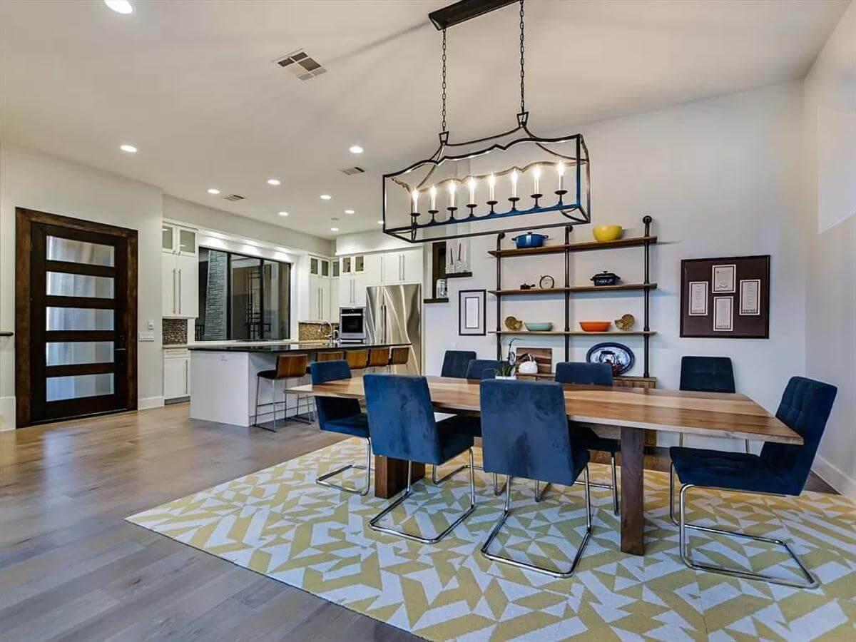 Notice the Bold Lighting Fixture in This Contemporary Dining Space