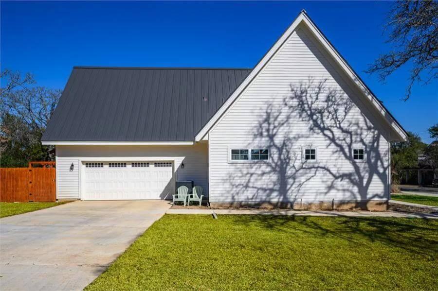 Classic Gable Roof and Metal Finish Adorn this Farmhouse Garage