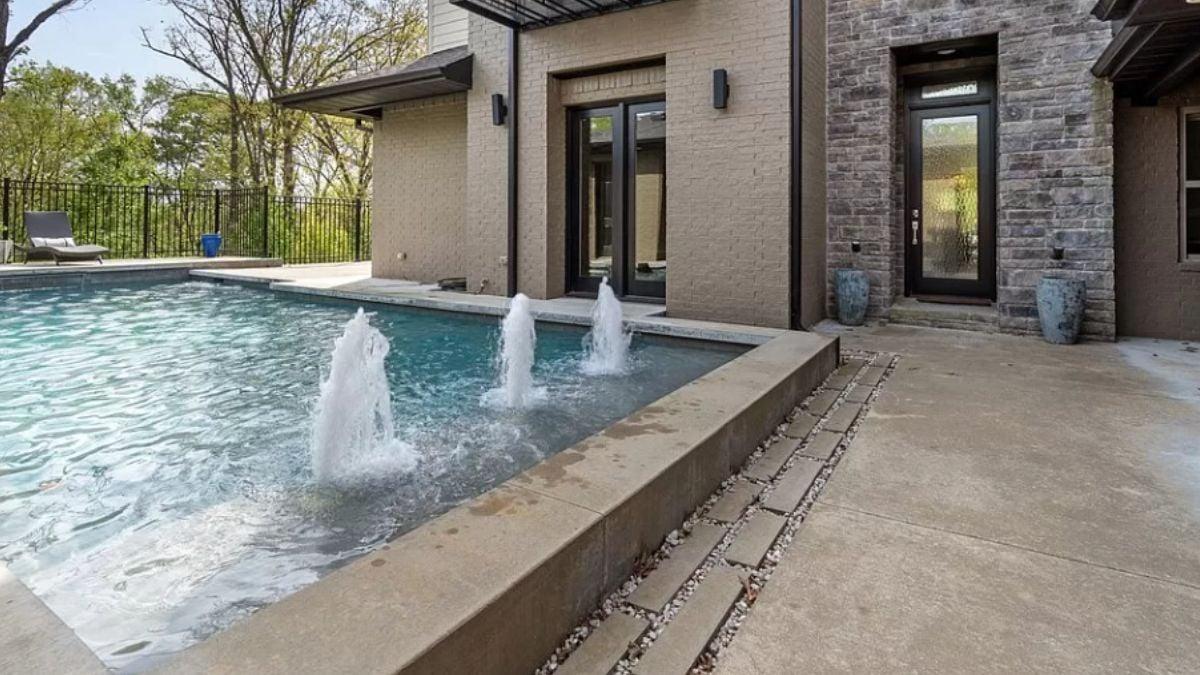 Modern Pool Area with Striking Water Features