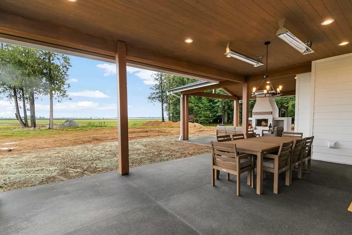 Wow, Look at This Expansive Outdoor Dining Space With a Cozy Fireplace