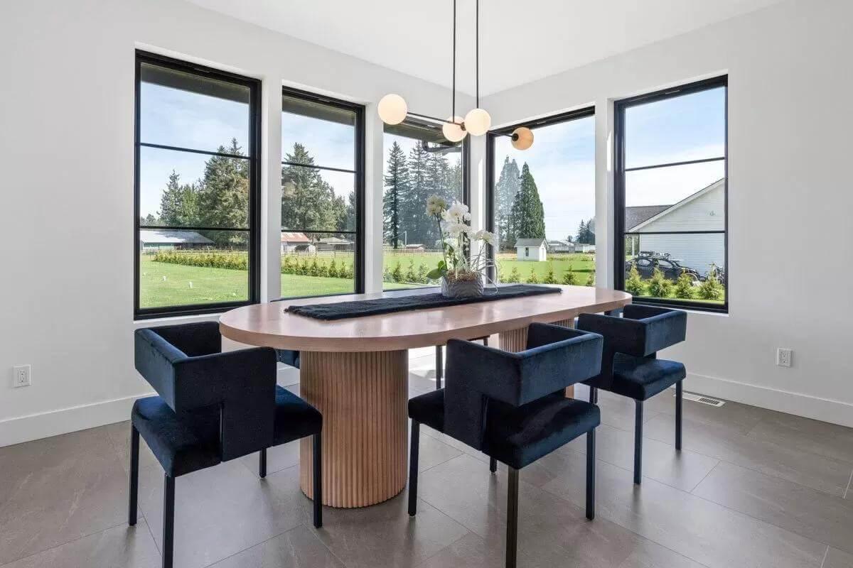Modern Dining Nook with Bold Black Accents and Serene Views