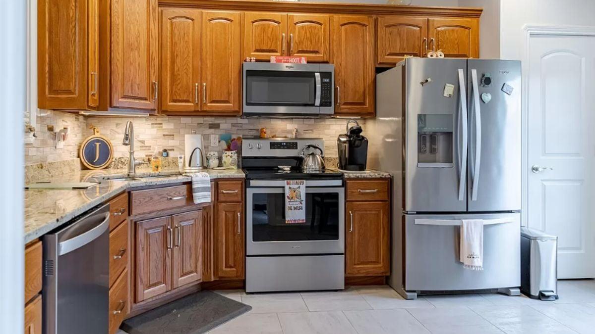 Traditional Kitchen with Warm Wood Cabinets and Sleek Stainless Steel Appliances