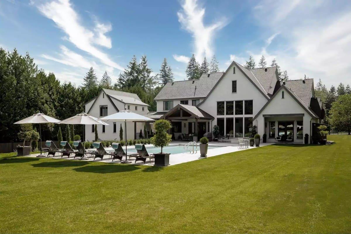 Marvel at the Expansive Windows Overlooking This Inviting Poolside