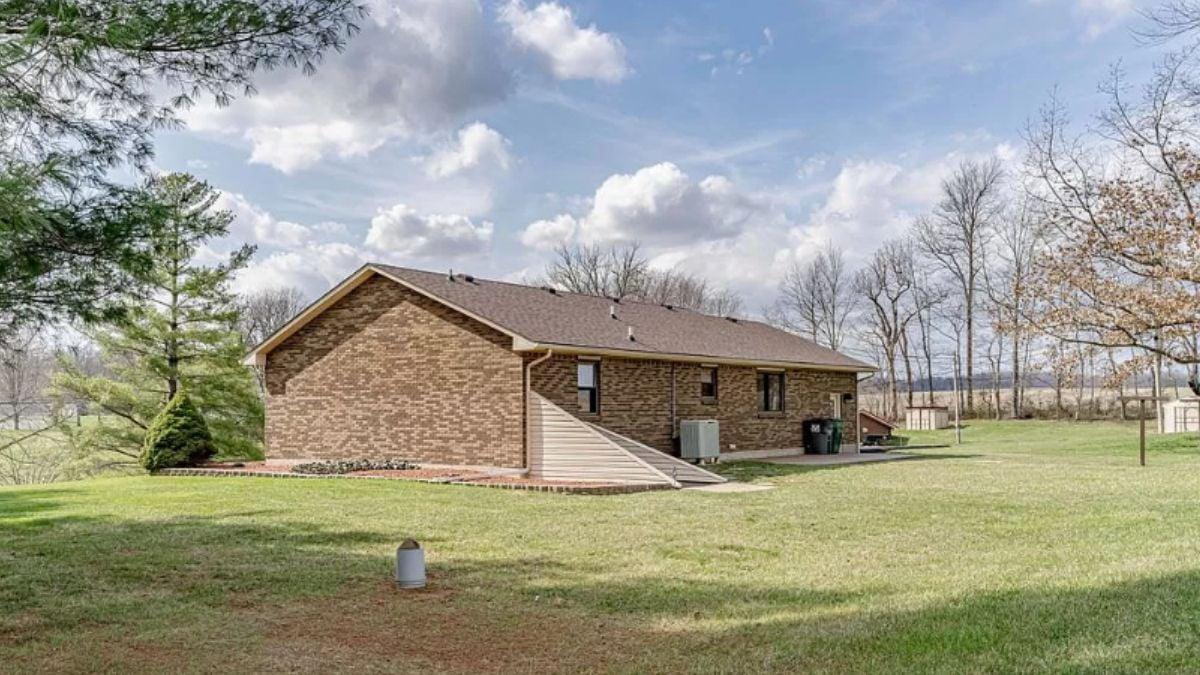 Side View of Brick Ranch Amidst Open Spaces