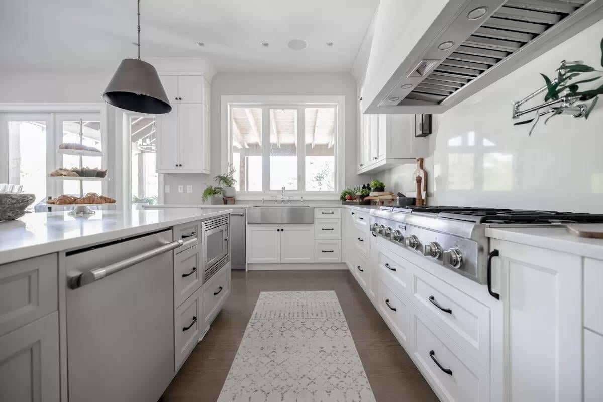 Expansive Kitchen with a Practical Farmhouse Sink and Industrial Range