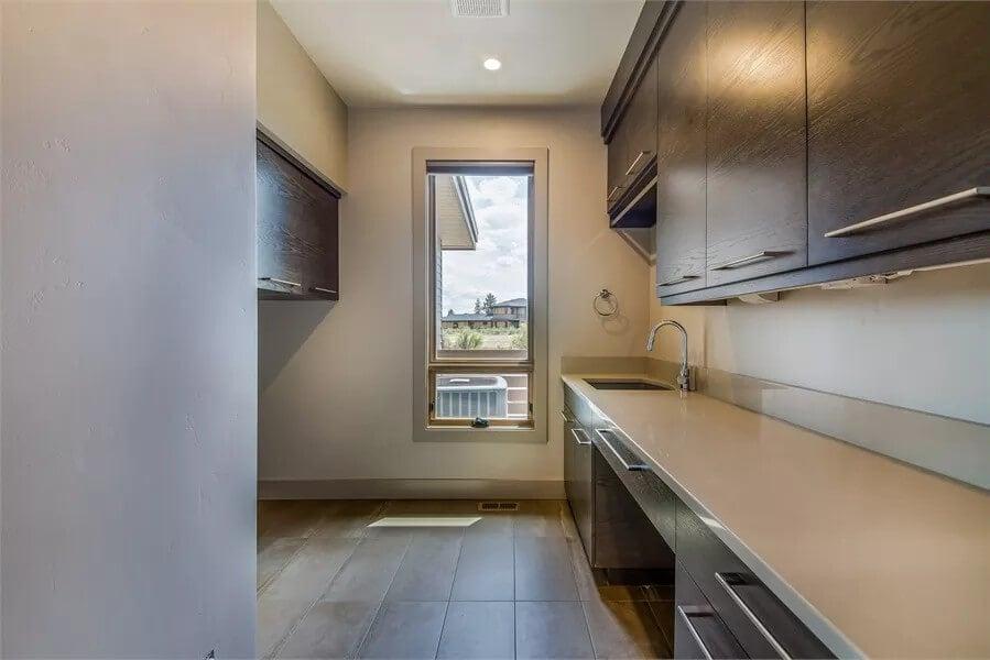 Admire the Sleek Cabinetry in This Modern Laundry Room