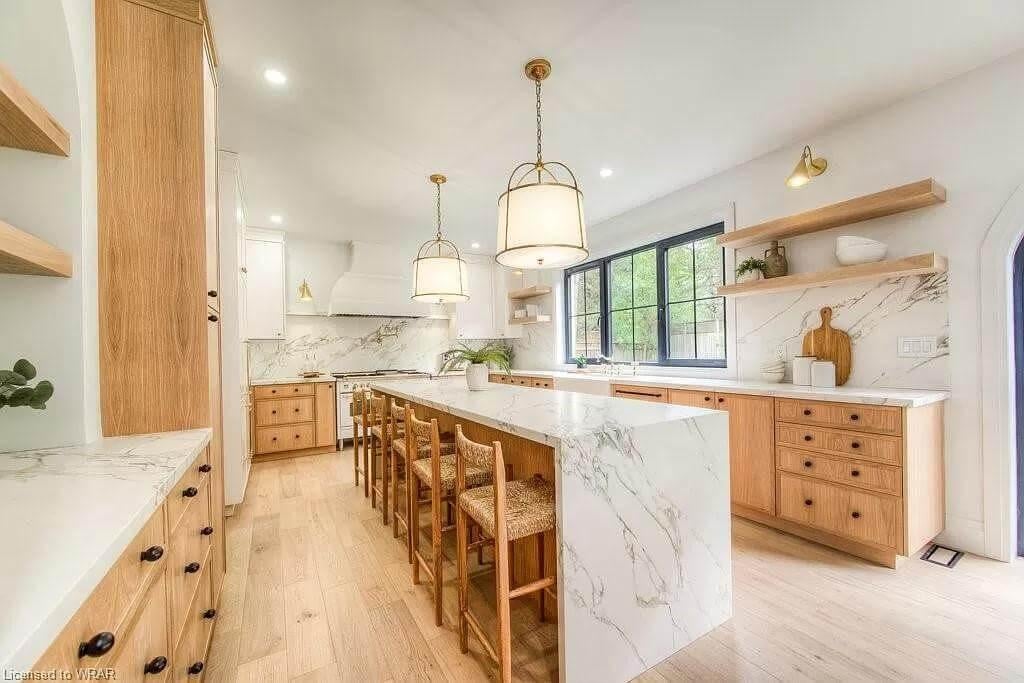 Wow, Check Out the Marble Island in This Warm Wood Kitchen