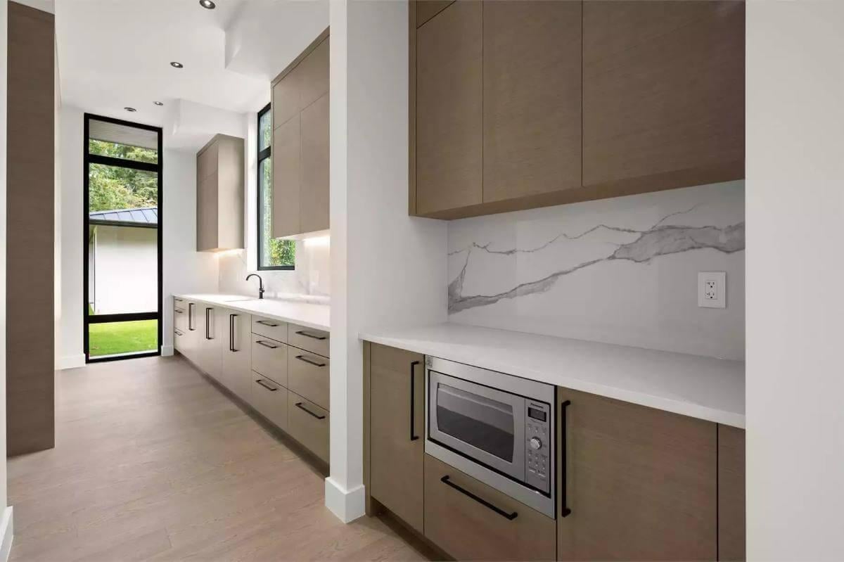 Check Out the Chic Butlers Pantry with Marble Backsplash