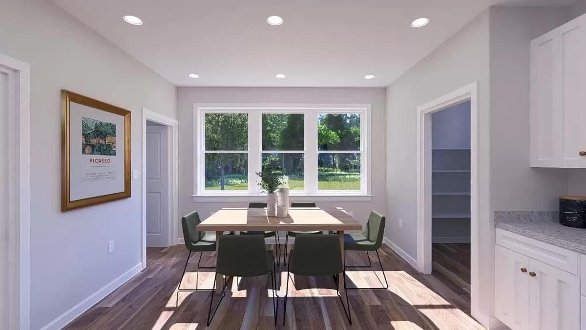 Sunlit Dining Nook with Garden Views and Modern Art