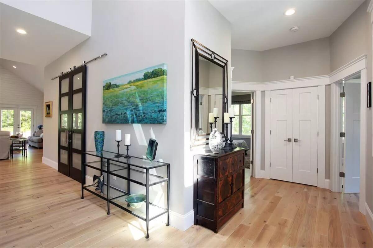 Elegant Entryway with Striking Modern Barn Door