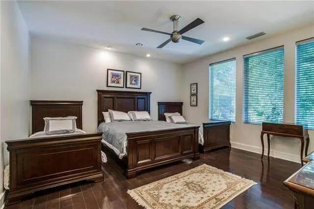 Classic Bedroom Featuring Rich Wood Furniture and Thoughtful Details