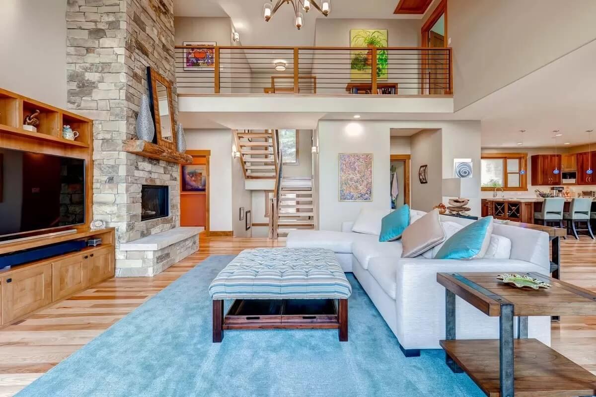 Rustic Stone Fireplace with Modern Flair and an Open Loft