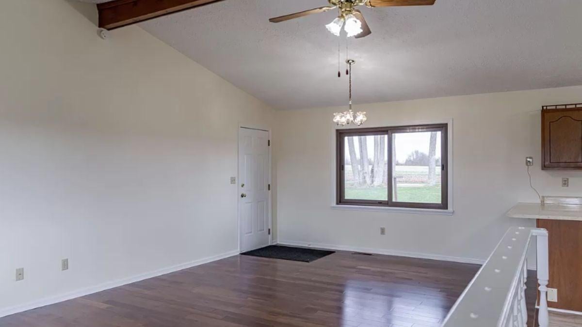 Bright Living Room with Vaulted Ceiling and Wood Beam Detail