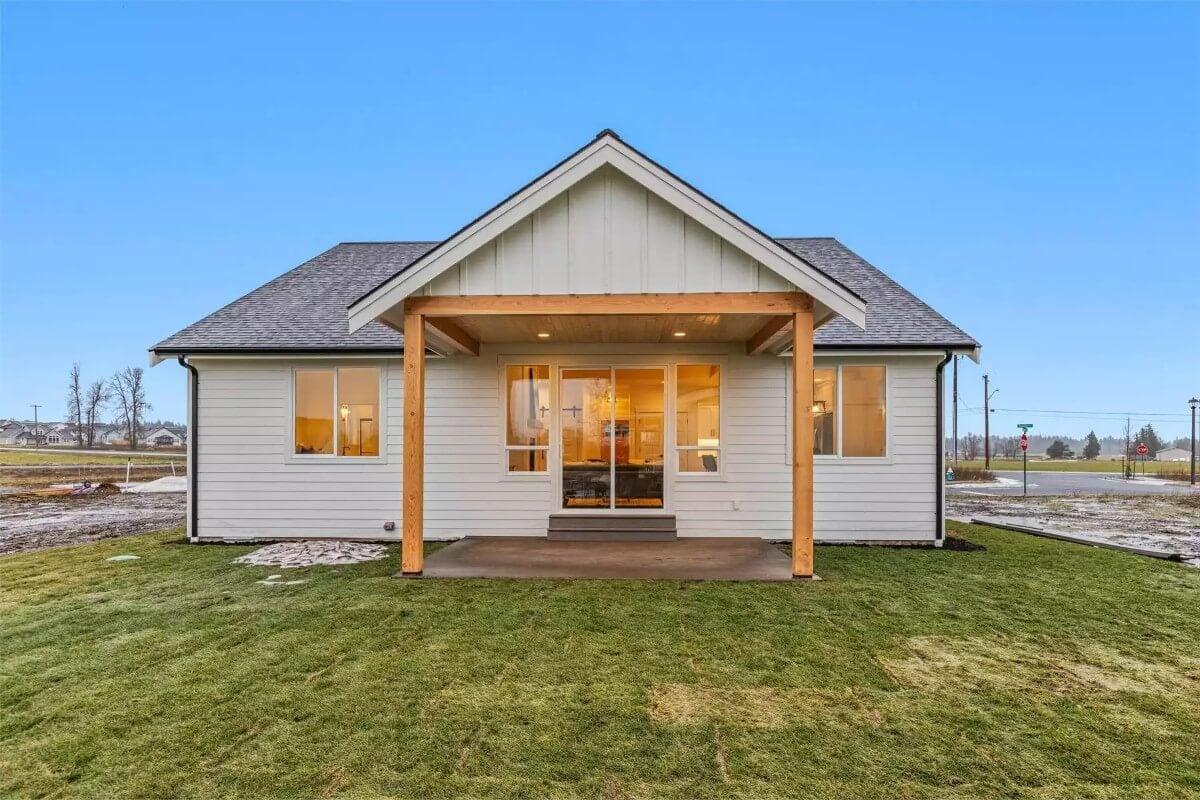 Craftsman Home With a Rustic Porch Featuring Warm Wooden Posts