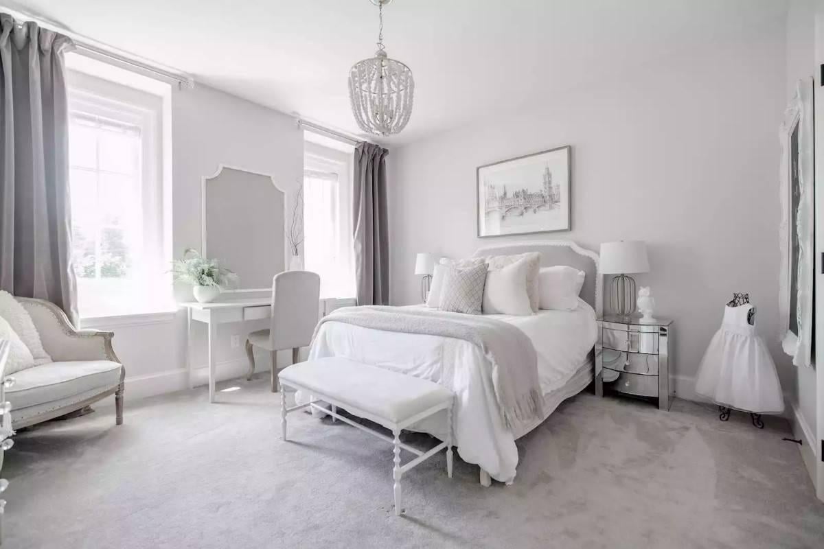 Look at the Soft Grey Accents and Charming Chandelier in This Bedroom