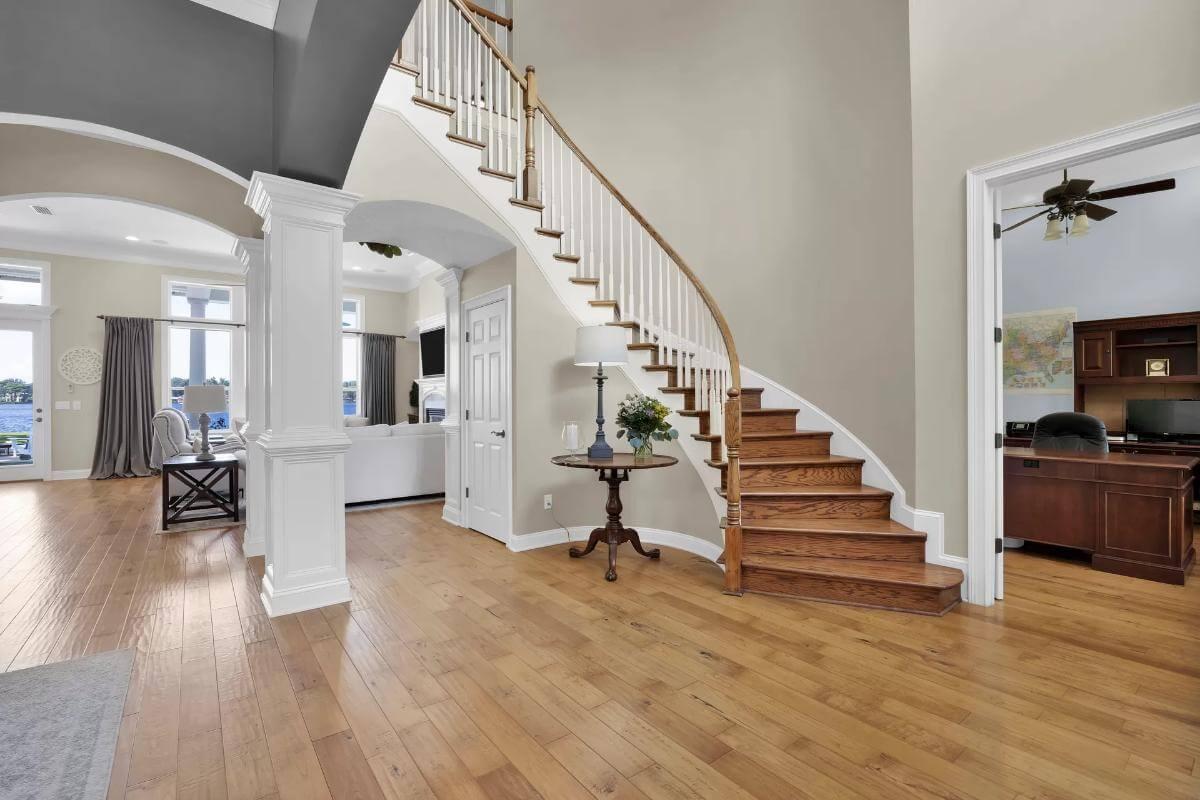 Admire the Graceful Curve of This Staircase in a Grand Foyer