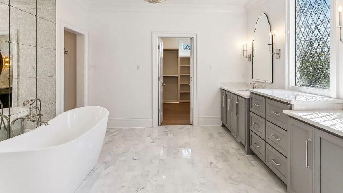 Step Into This Spa-like Bathroom with a Freestanding Tub and Stylish Mirrors