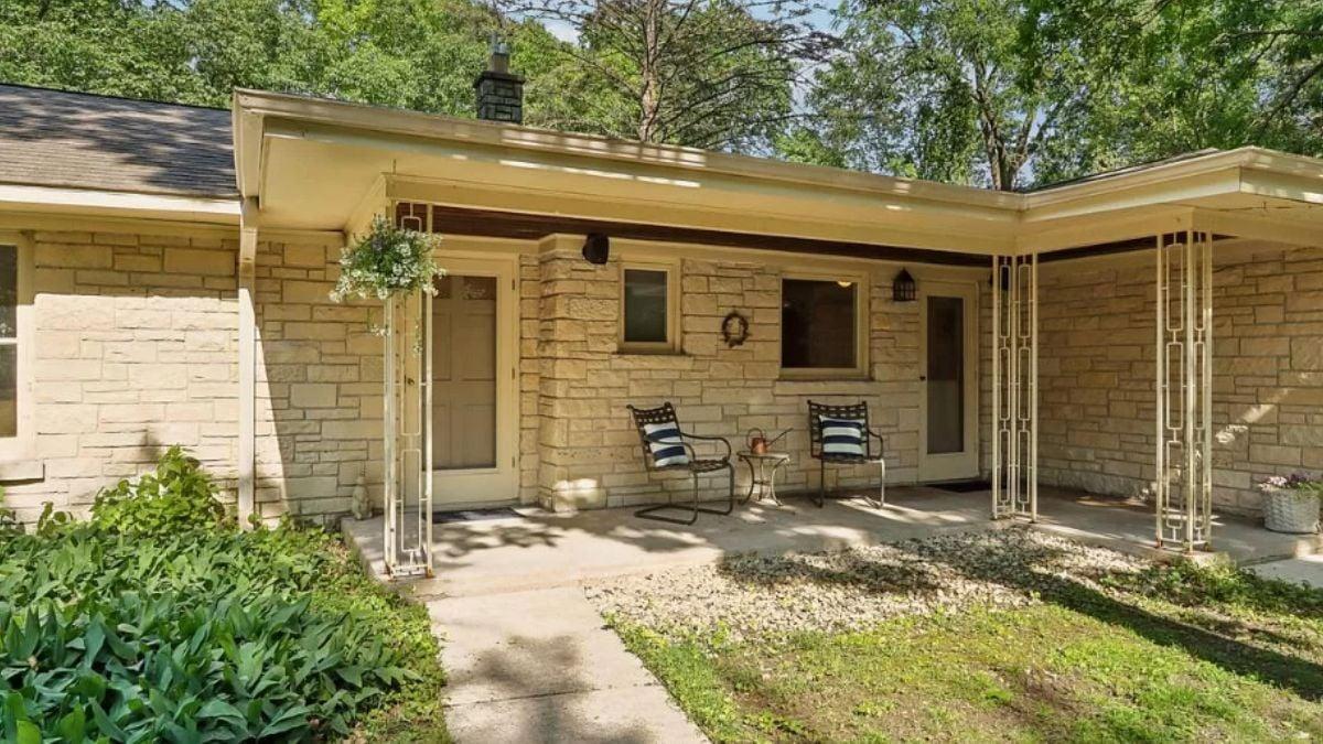 Relax on This Charming Front Porch with Stone Façade