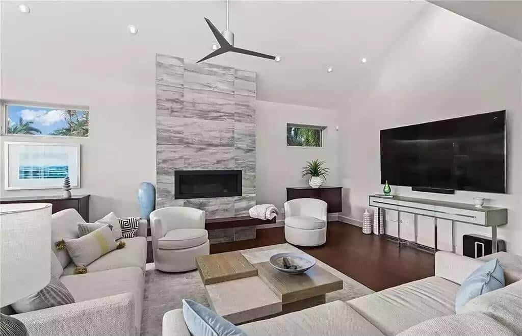 Modern Living Room with Striking Marble Fireplace Accent