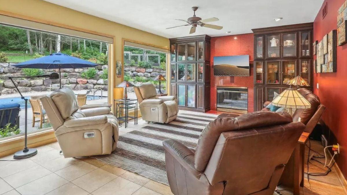 Relaxed Living Room with Patio Access and Built-In Displays