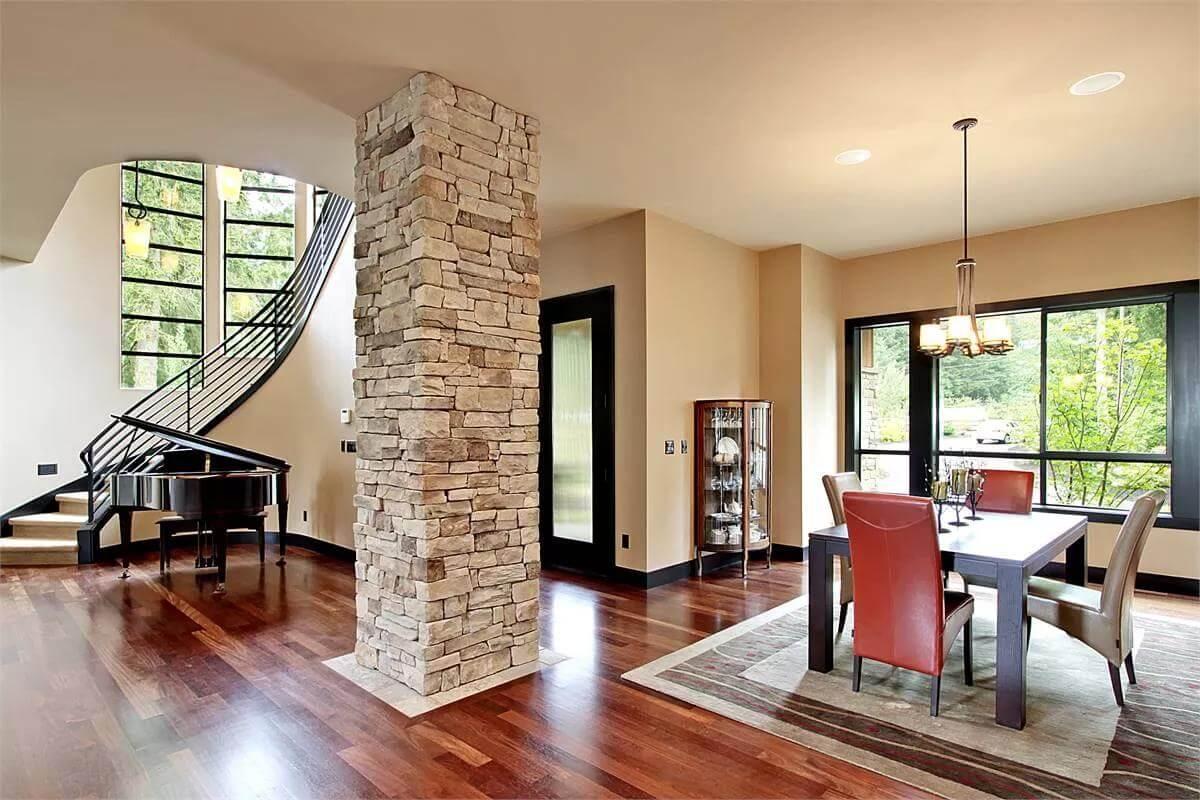 Notice the Grand Piano Beside the Stone Column in This Elegant Craftsman Space