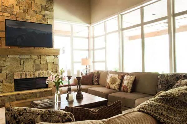 Cozy Living Room with Stone Fireplace and L-Shaped Sofa