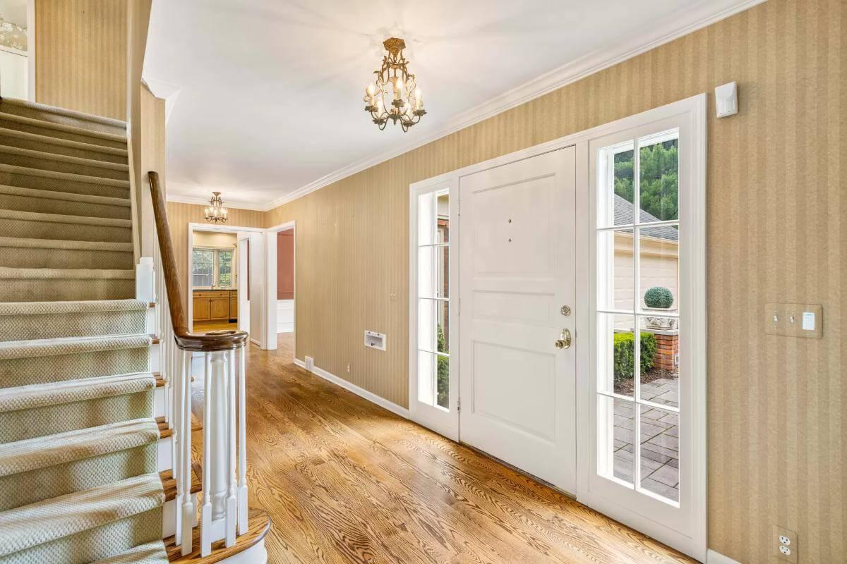 Elegant Entryway with Classic Staircase and Natural Light