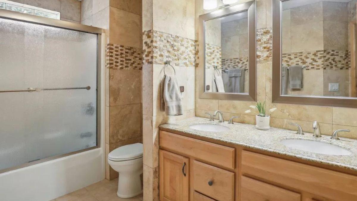 Dual Vanities and Mosaic Details Shine in This Craftsman Bathroom
