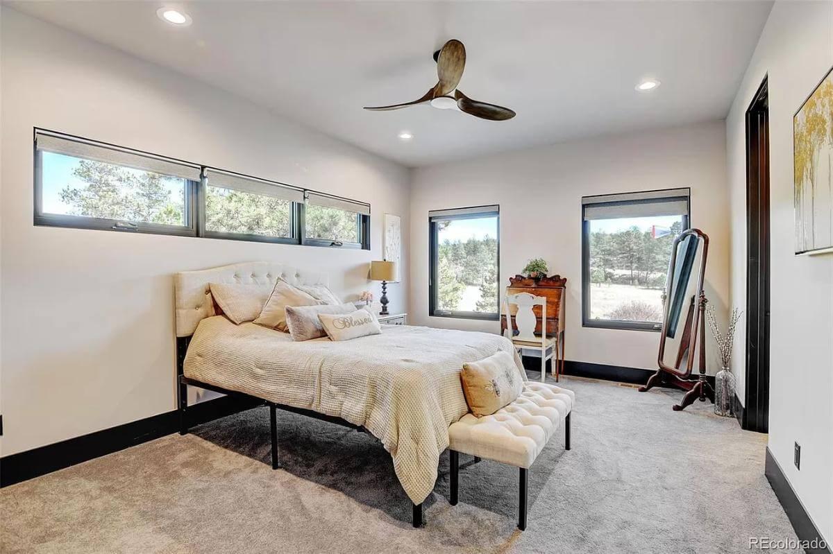 Serene Bedroom with Textured Fan and Thoughtful Window Placement