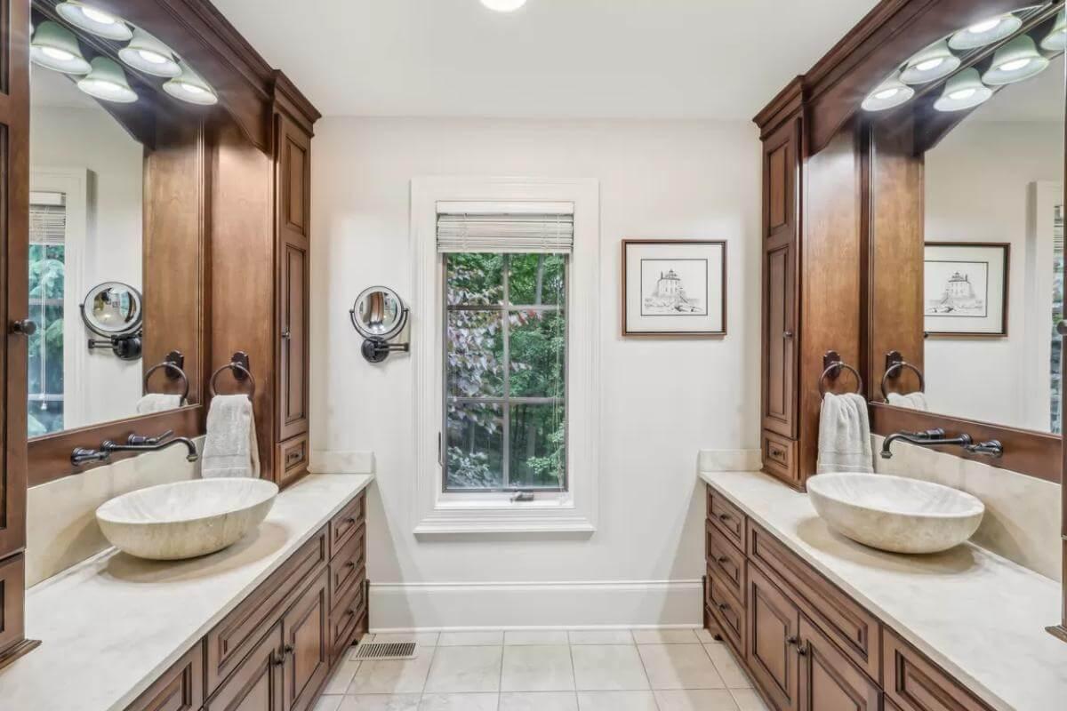 Dual Vanities and Wooden Cabinetry in a Balanced Design
