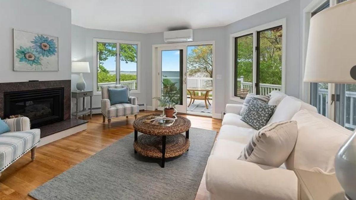 Living Room by the Bay: Windows, Light, and a Fireplace