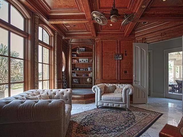 Notice the Rich Woodwork and Elegant Built-in Bookshelves