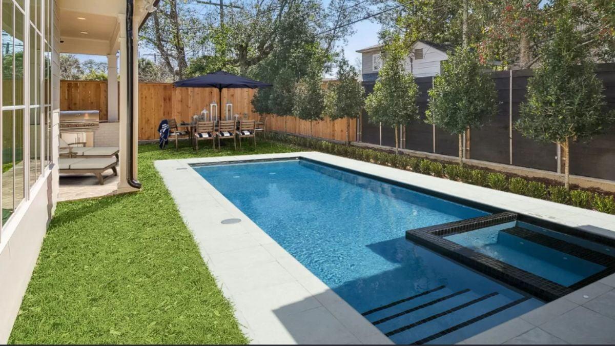 Imagine Relaxing by This Sleek Pool with Integrated Spa