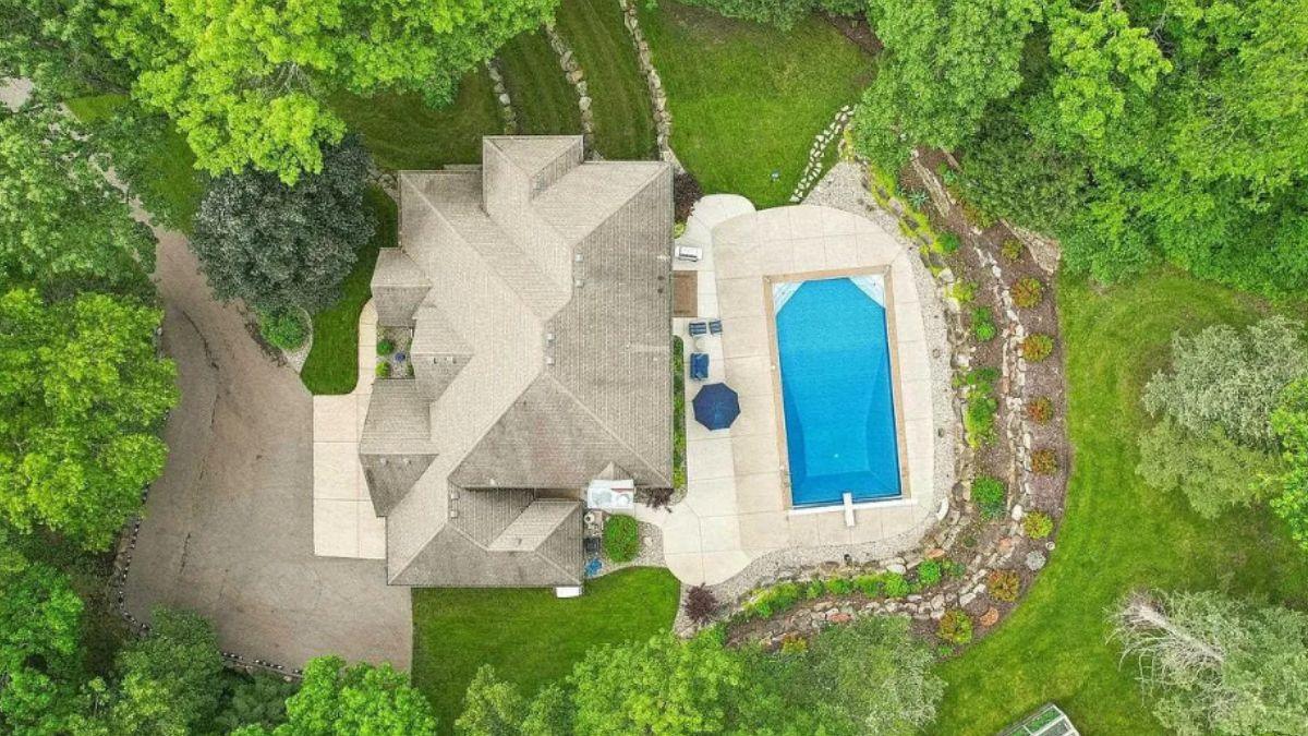 Aerial View of Craftsman Home with Stunning Pool Oasis