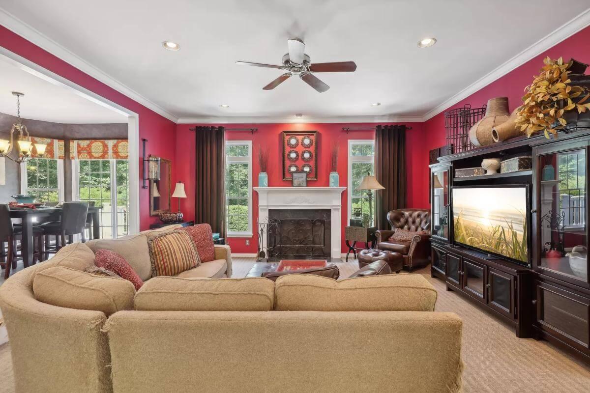 Bold Red Living Room with Traditional Touches and Fireplace Focal Point