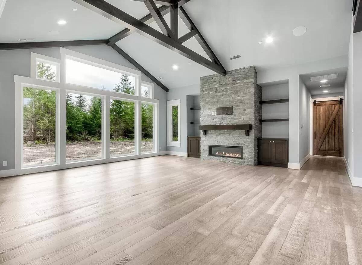 Take in the Vaulted Beams and Cozy Fireplace in This Craftsman Living Room