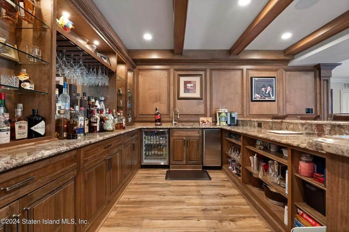 Explore the Rich Wood Detailing in This Home Bar