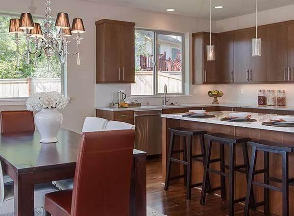 Dining and Kitchen Blend with a Lovely Chandelier Highlight