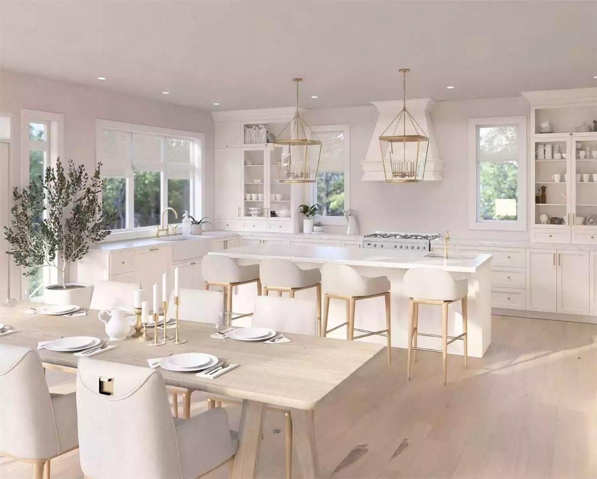 White Kitchen with Dramatic Gold Pendant Lights and Ample Natural Light