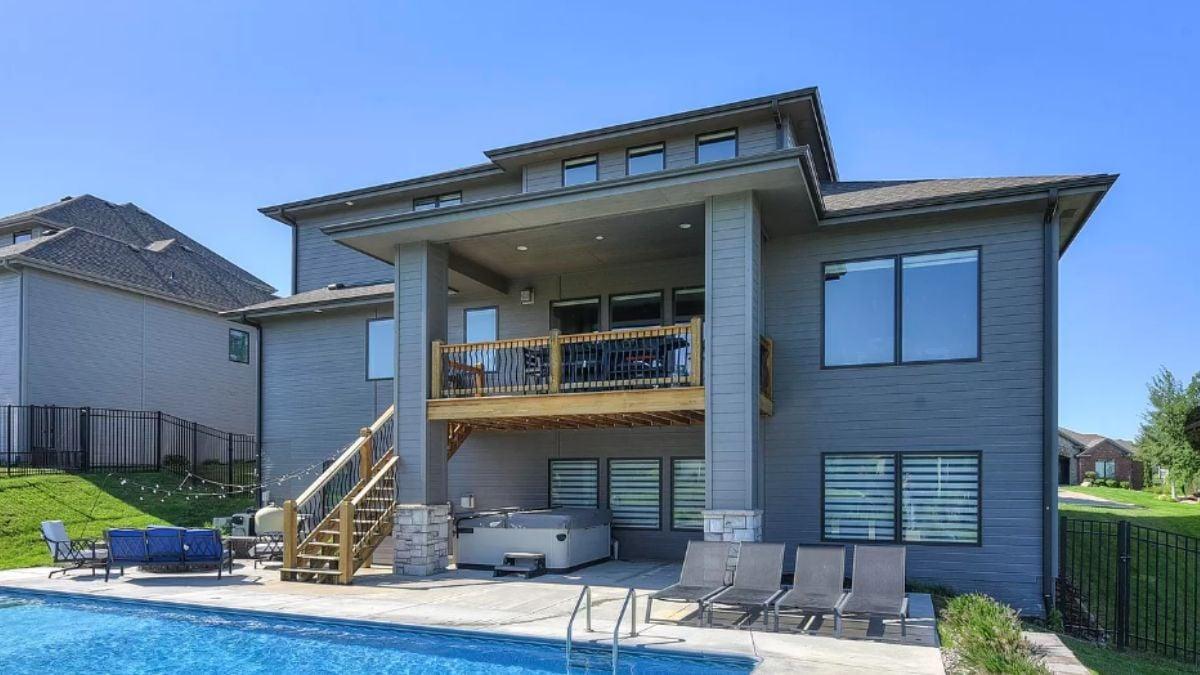 Craftsman Charm with a Modern Deck Overlooking the Pool