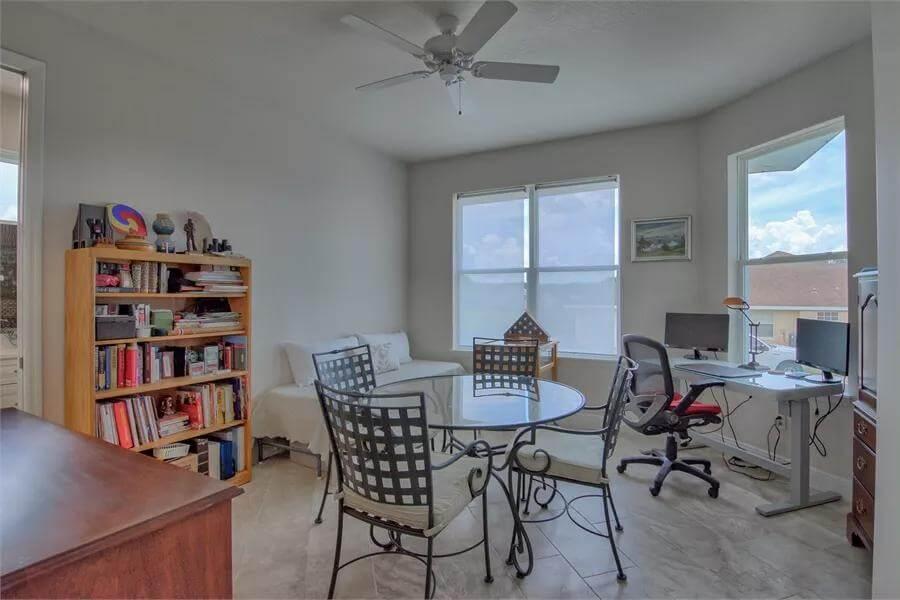 Notice the Versatile Home Office with Iron Accents and a Cozy Nook