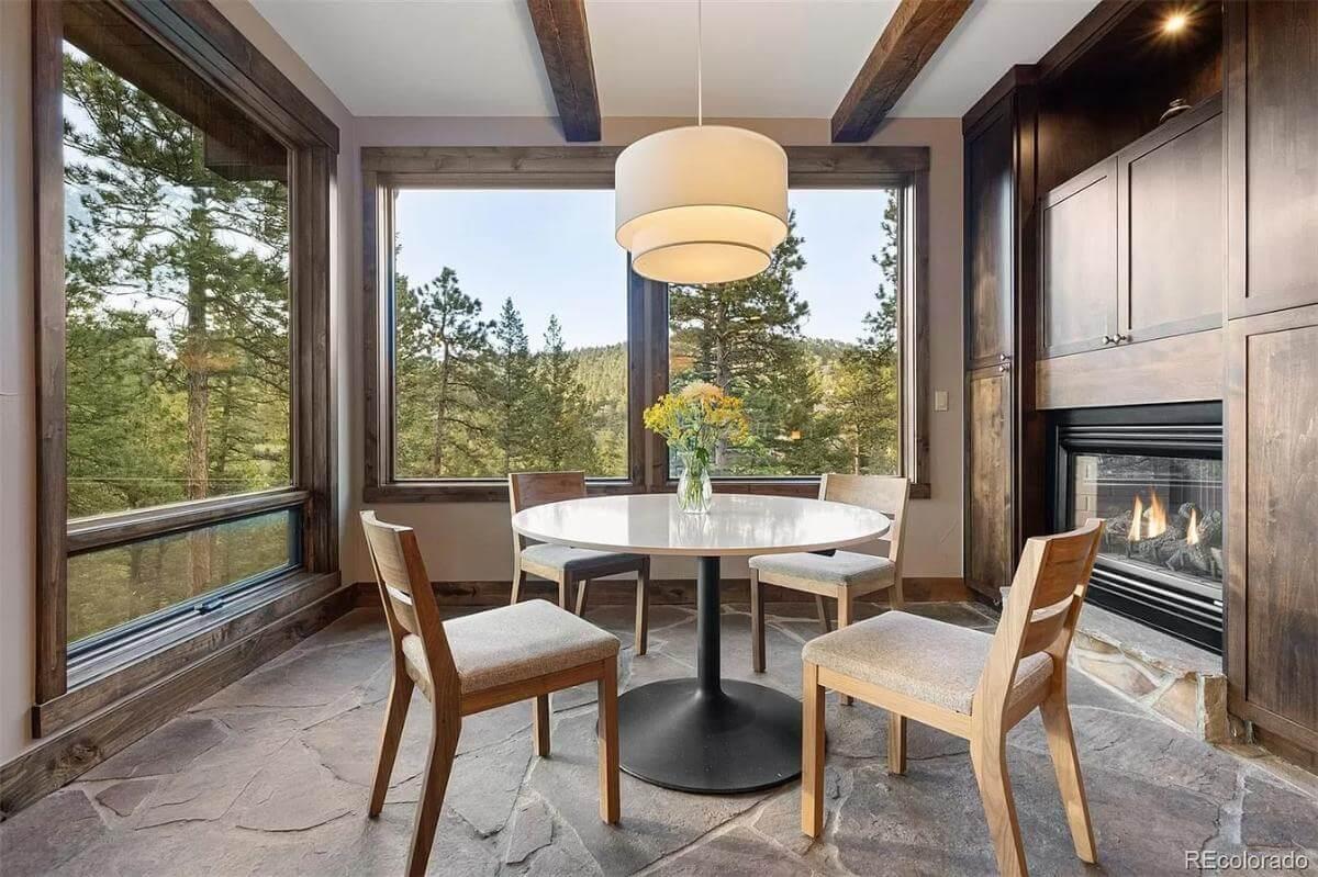 Cozy Breakfast Nook with Fireplace Warmth and Scenic Views