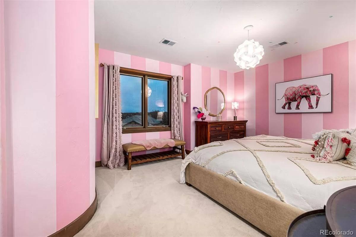 Check Out This Playful Bedroom with Candy Striped Walls