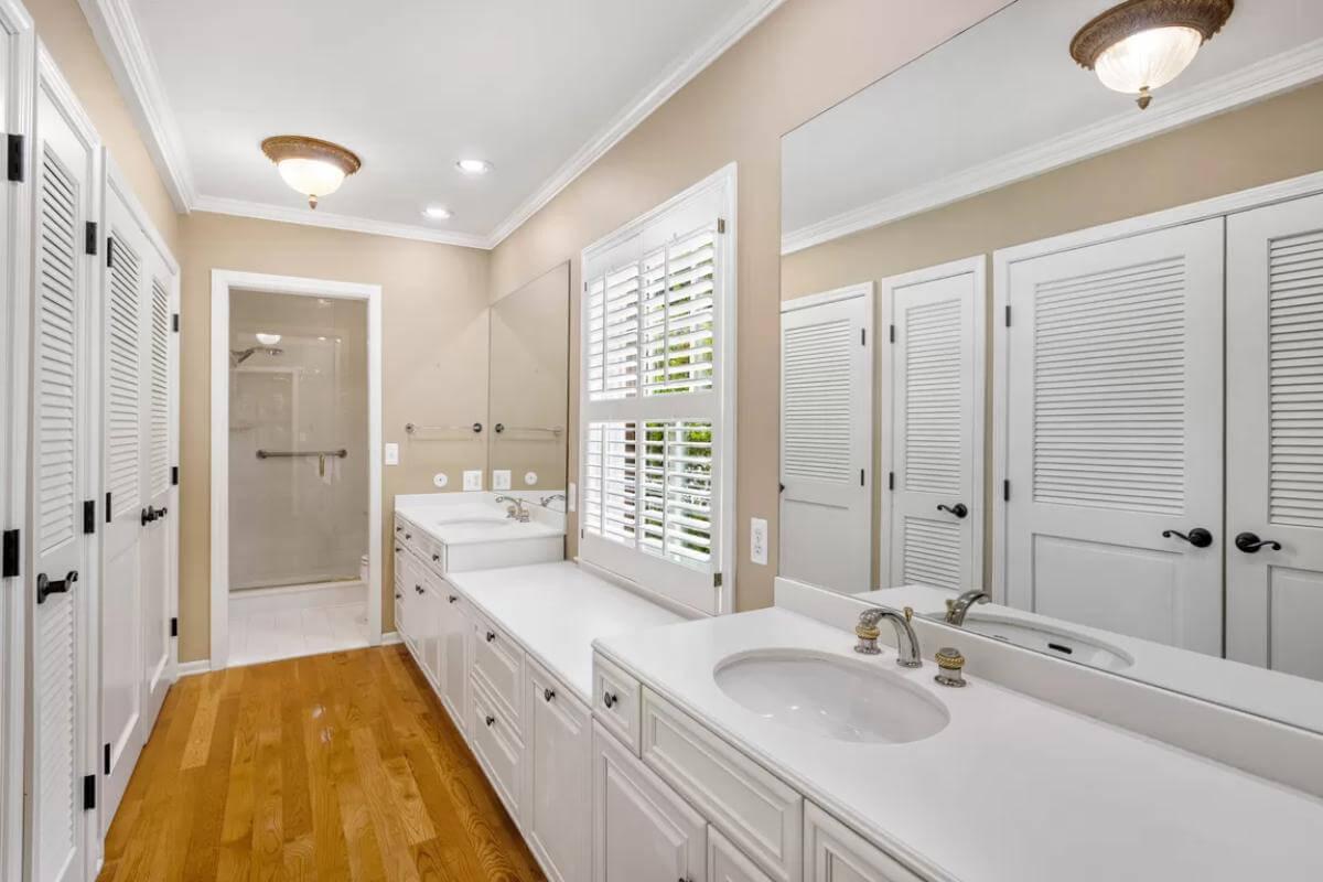 Double Vanity Bathroom with Plantation Shutters and Classic Touches