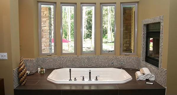 Relax in Style with This Spa-Like Tub and Picture Windows