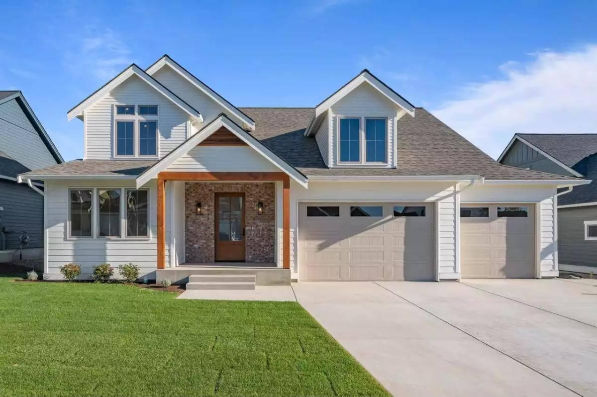 Craftsman Delight: Check Out the Brick Accents and Cozy Porch