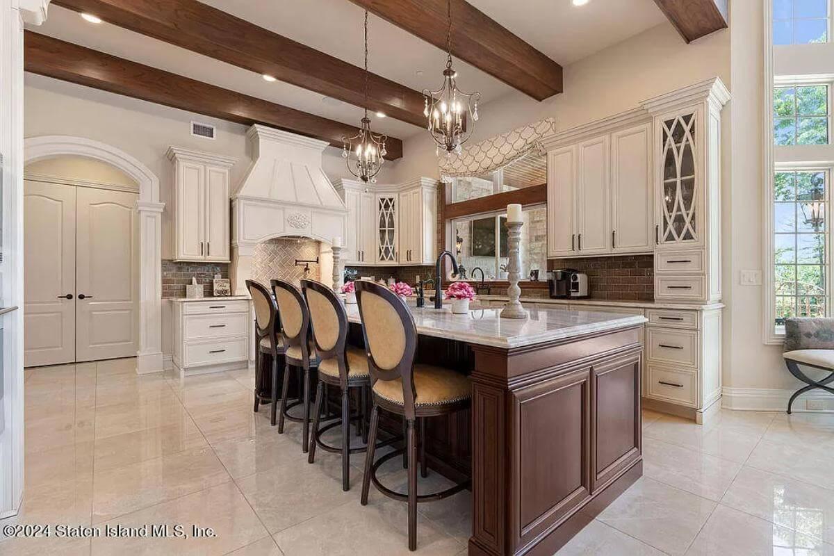 Marvel at These Rich Wooden Beams and Elegant Chandeliers in This Kitchen