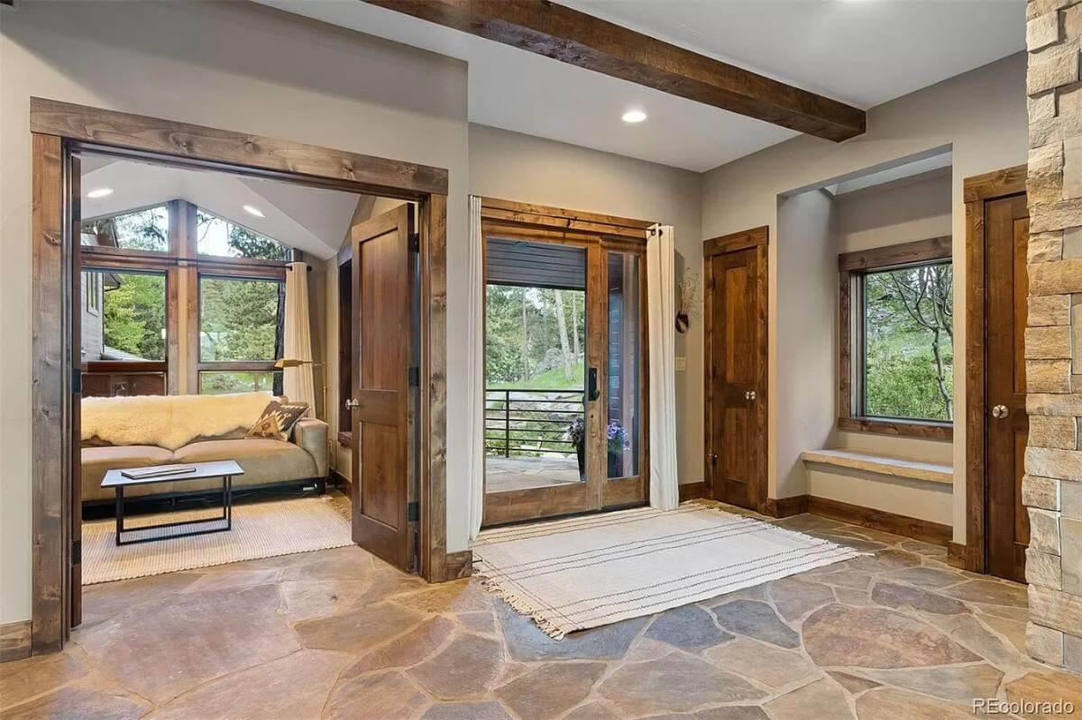 Rustic Entryway with Stone Flooring Leading to a Scenic View